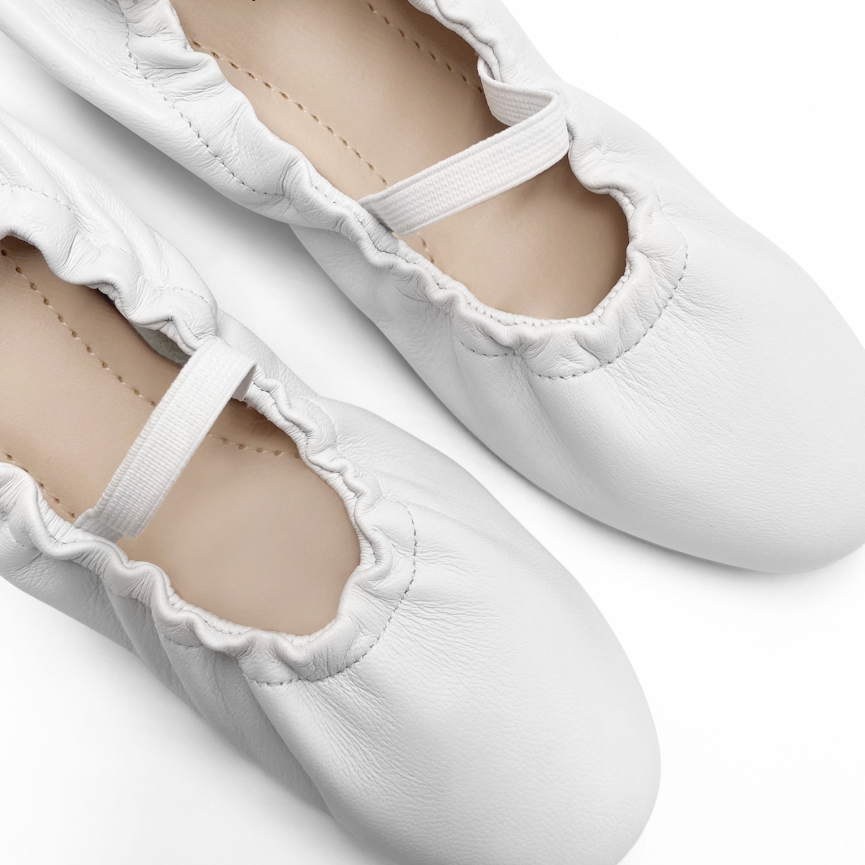 White leather glove ballet flats with elastic strap