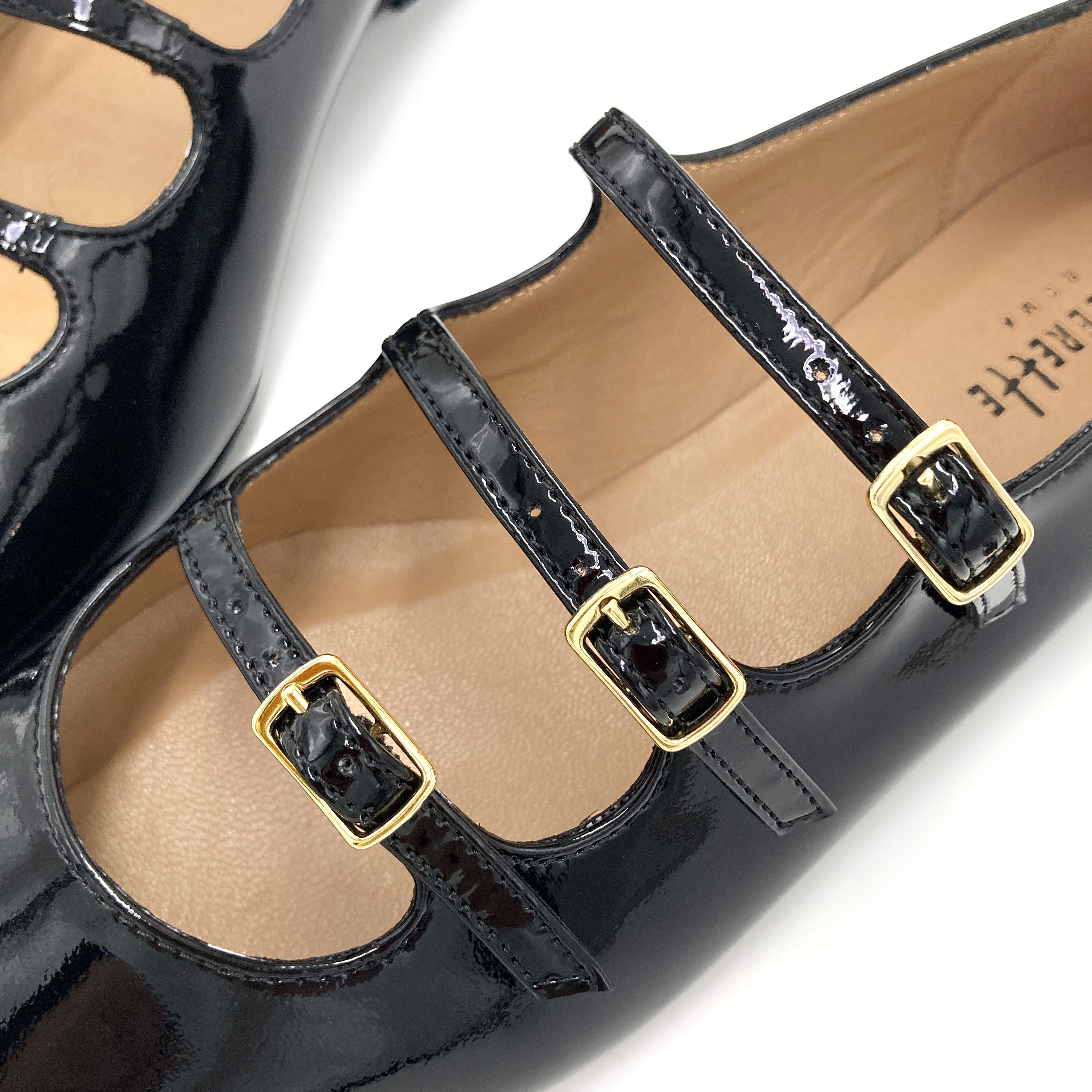 Black shiny pointed ballet flats with three straps