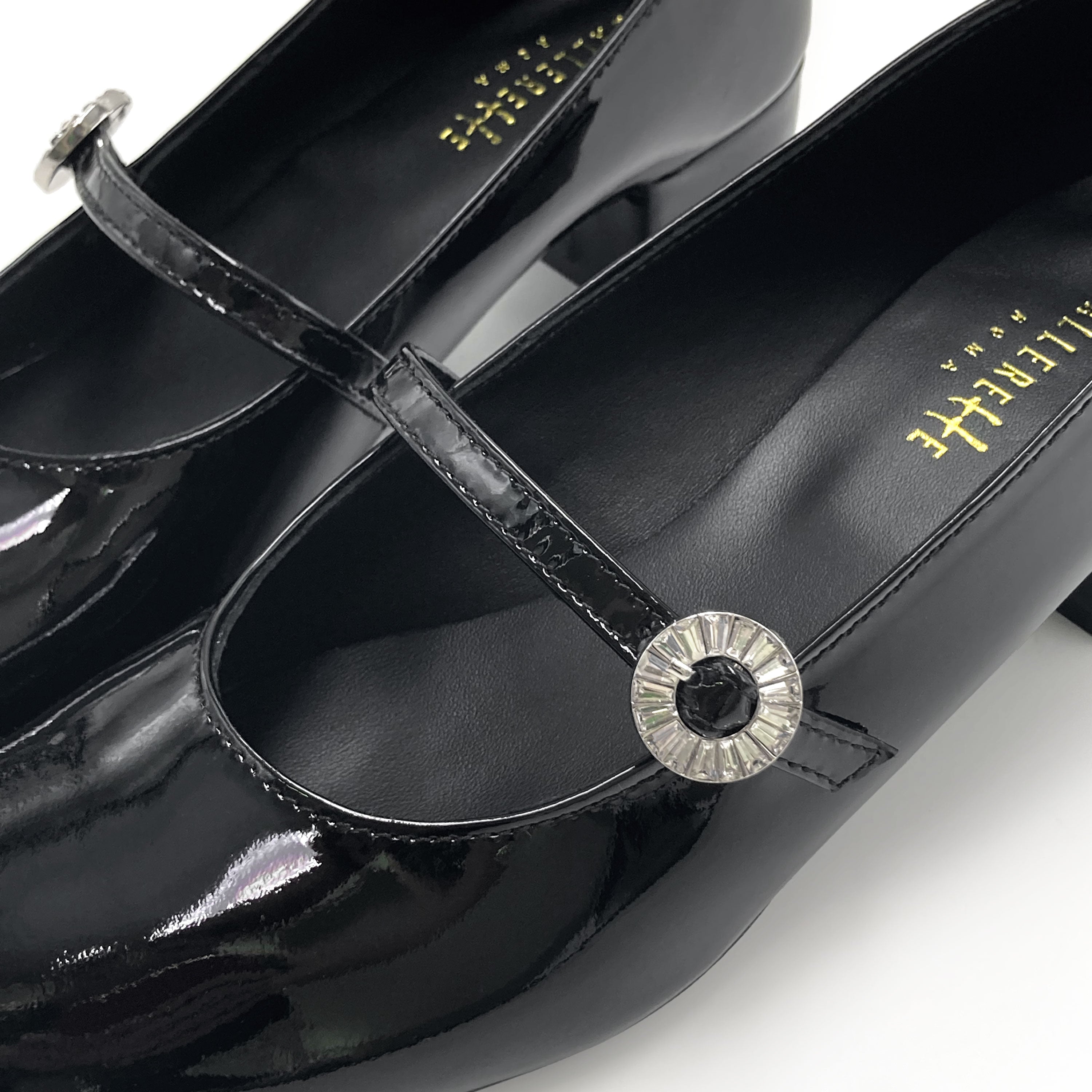 Black patent leather Mary Jane ballet flats with heel and jewelled strap