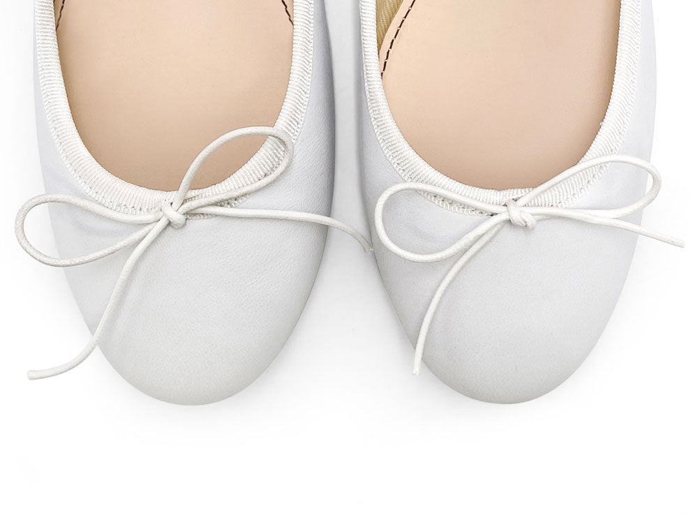 White leather ballet flats