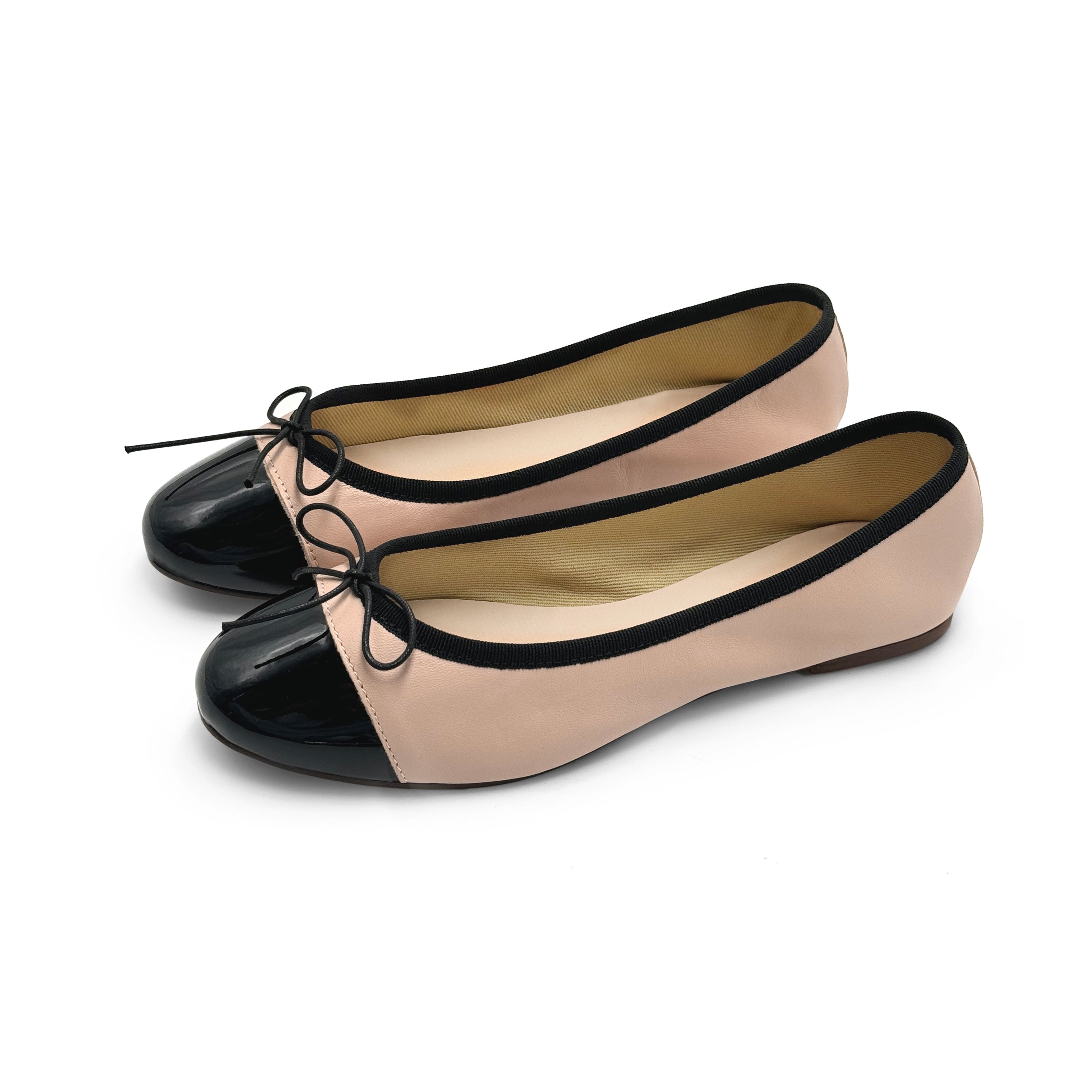 Blush pink leather ballet flats with black patent toe
