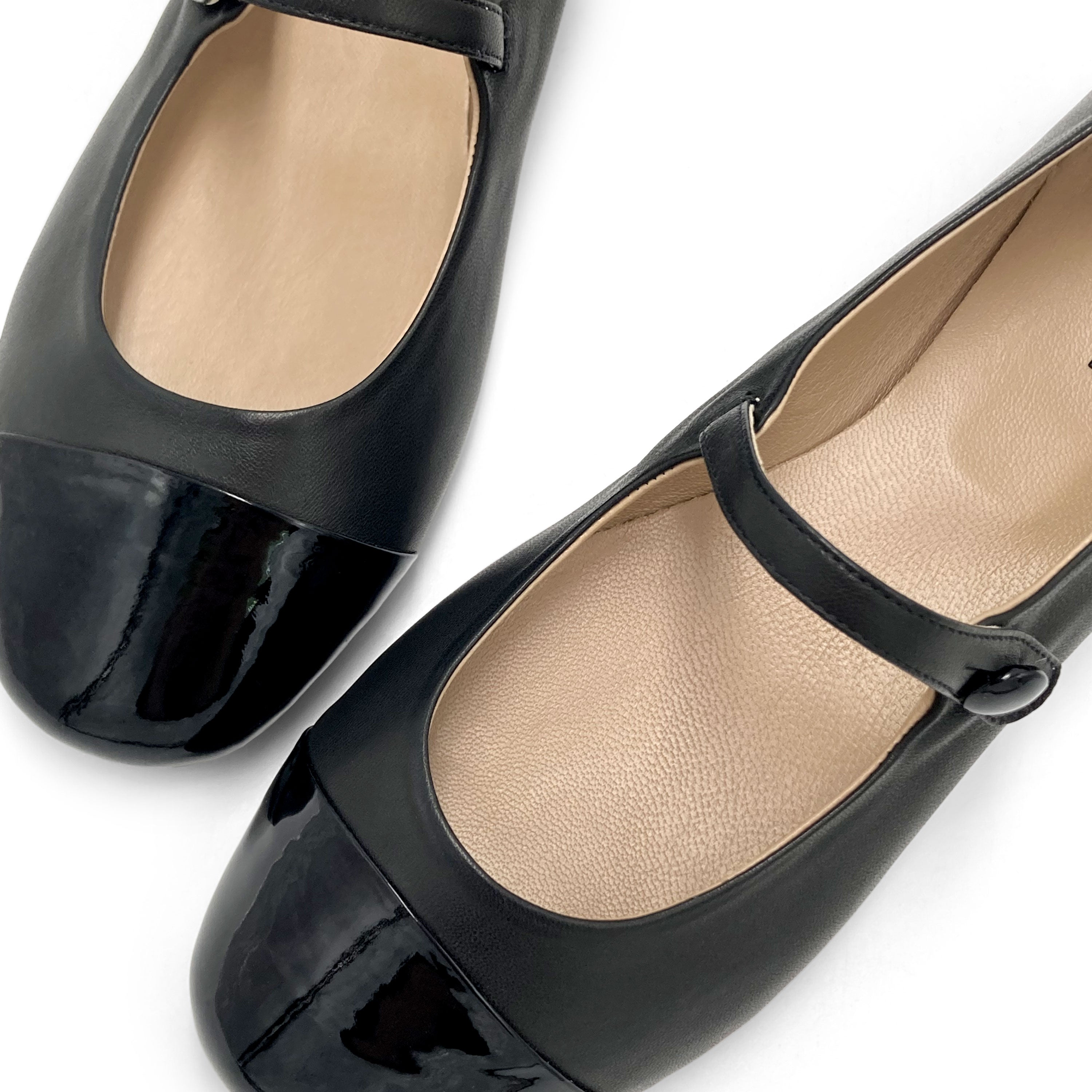 Black leather ballet flats with patent leather strap and toe