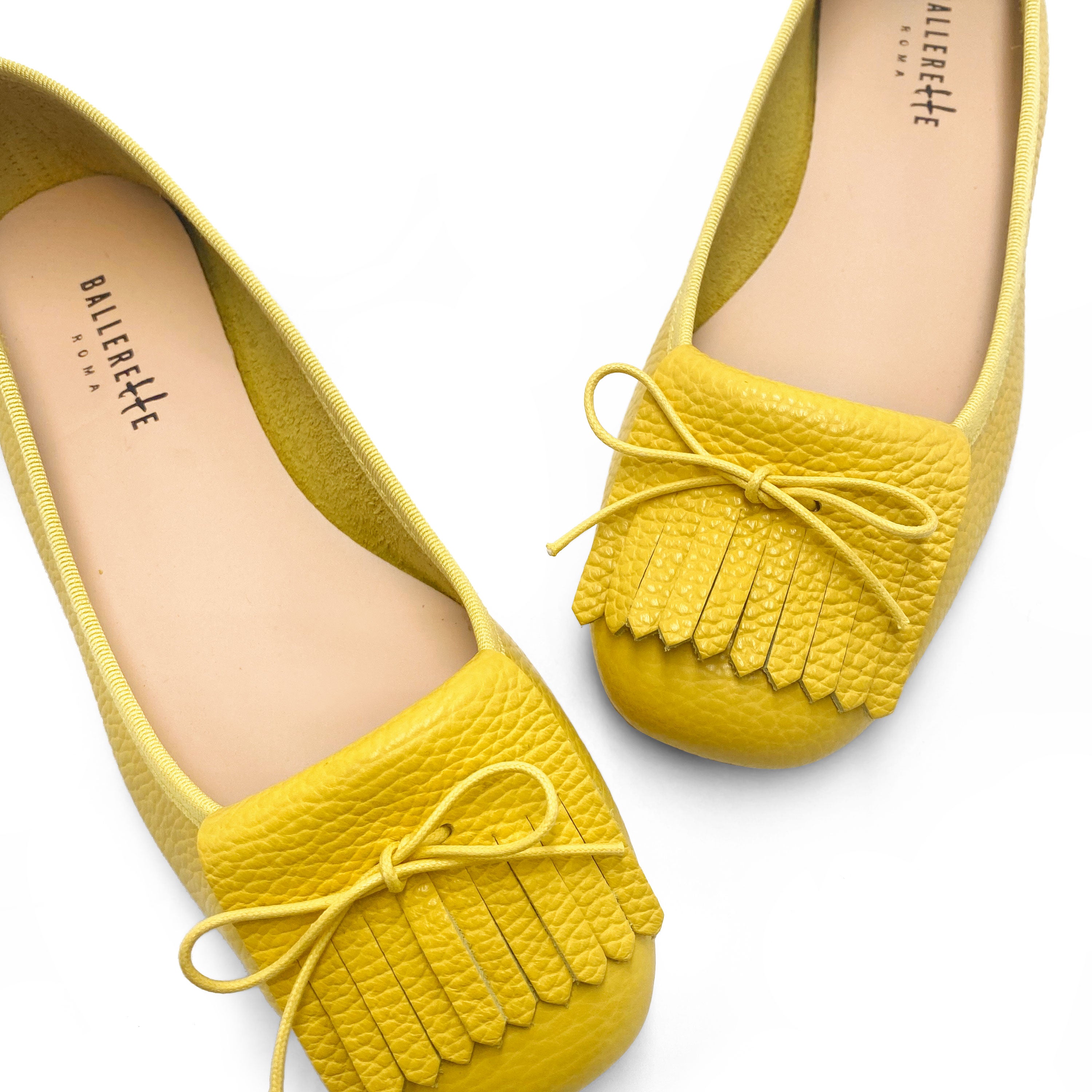 Yellow leather loafers with fringe tassel