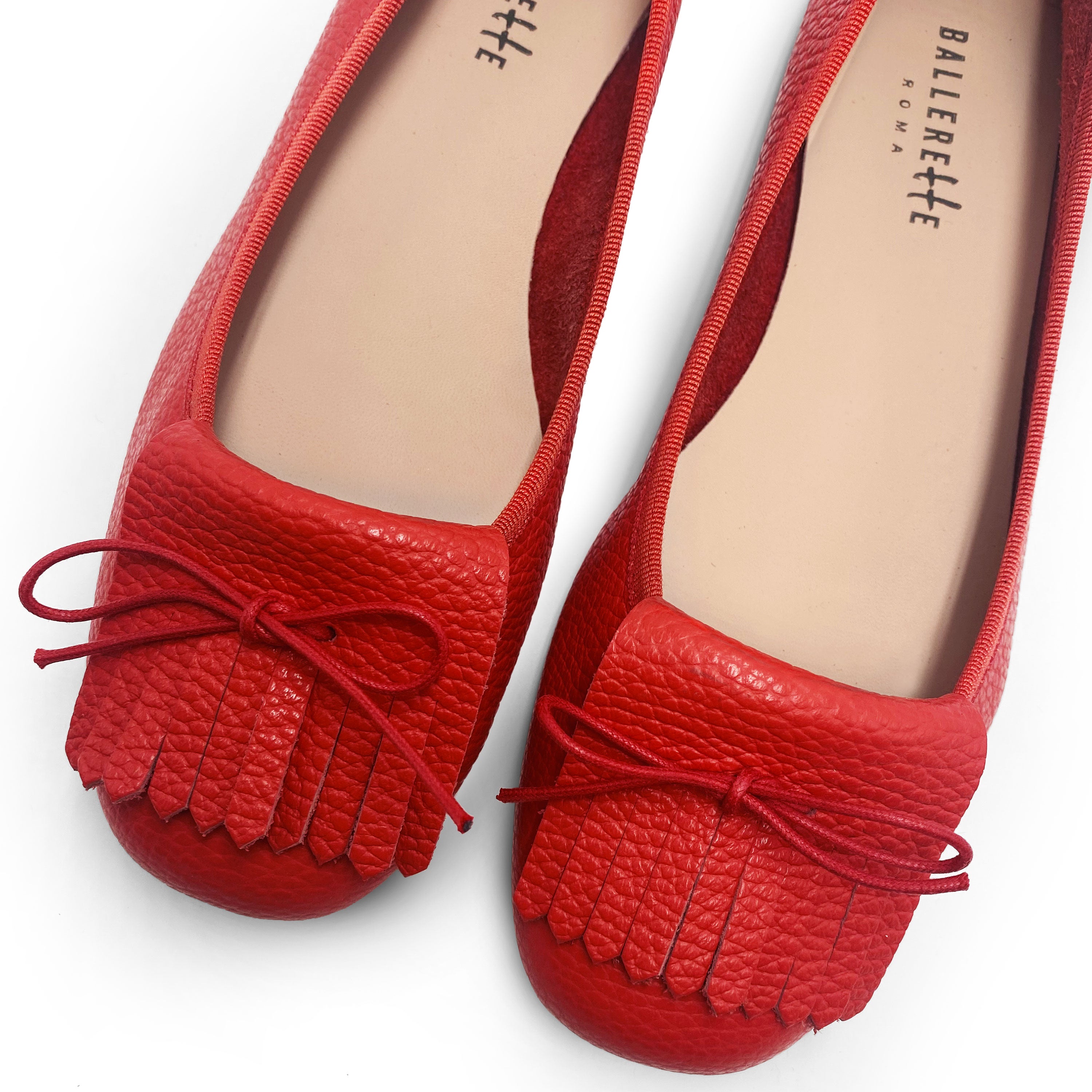 Mocassins femme rouges en cuir à franges