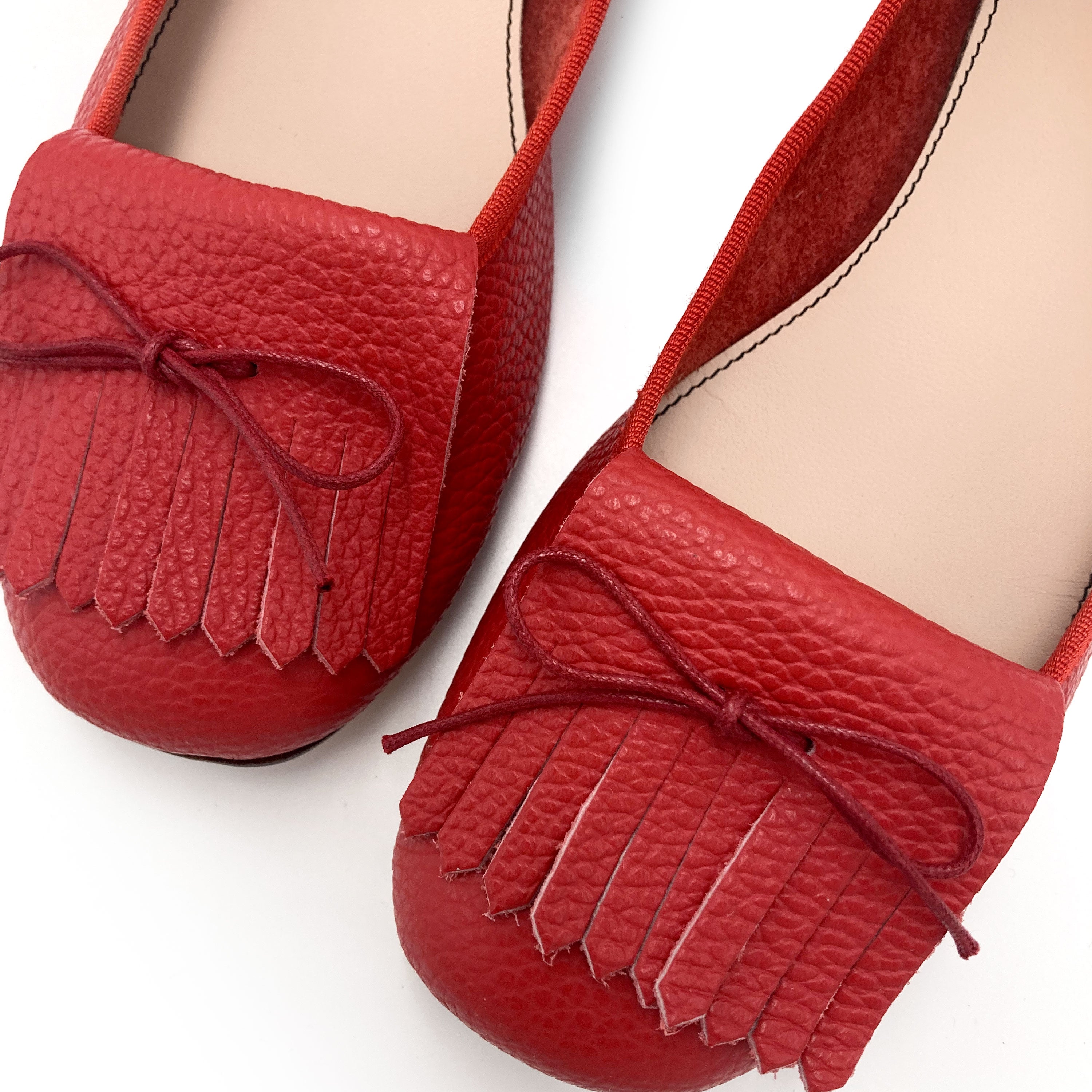 Mocassins femme rouges en cuir à franges