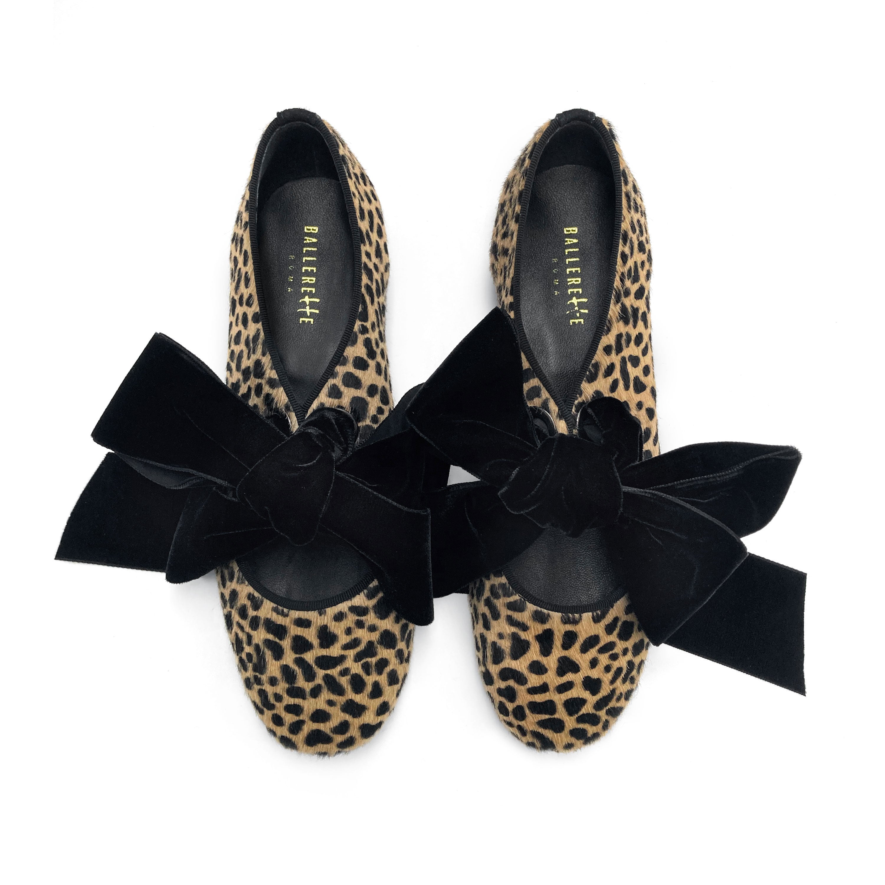 Damen Schuhe mit Animal-Print aus geflecktem Ponyfell