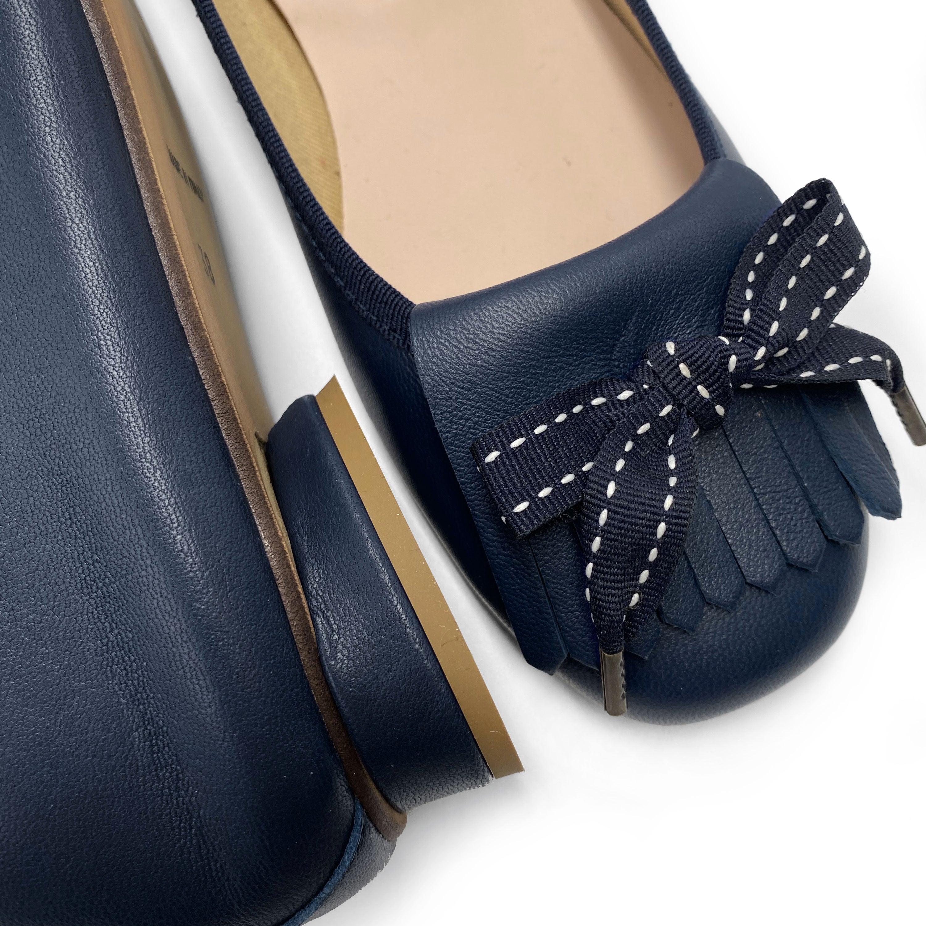 Mocassins en cuir bleu à talon et frange