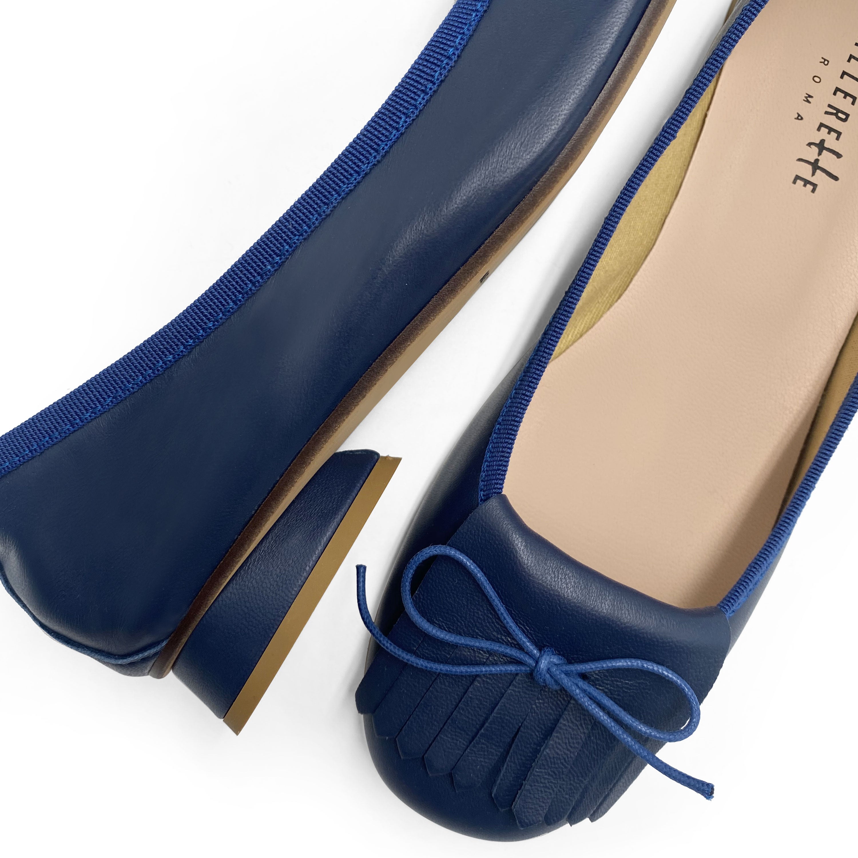 Mocassins en cuir bleu à talon et frange