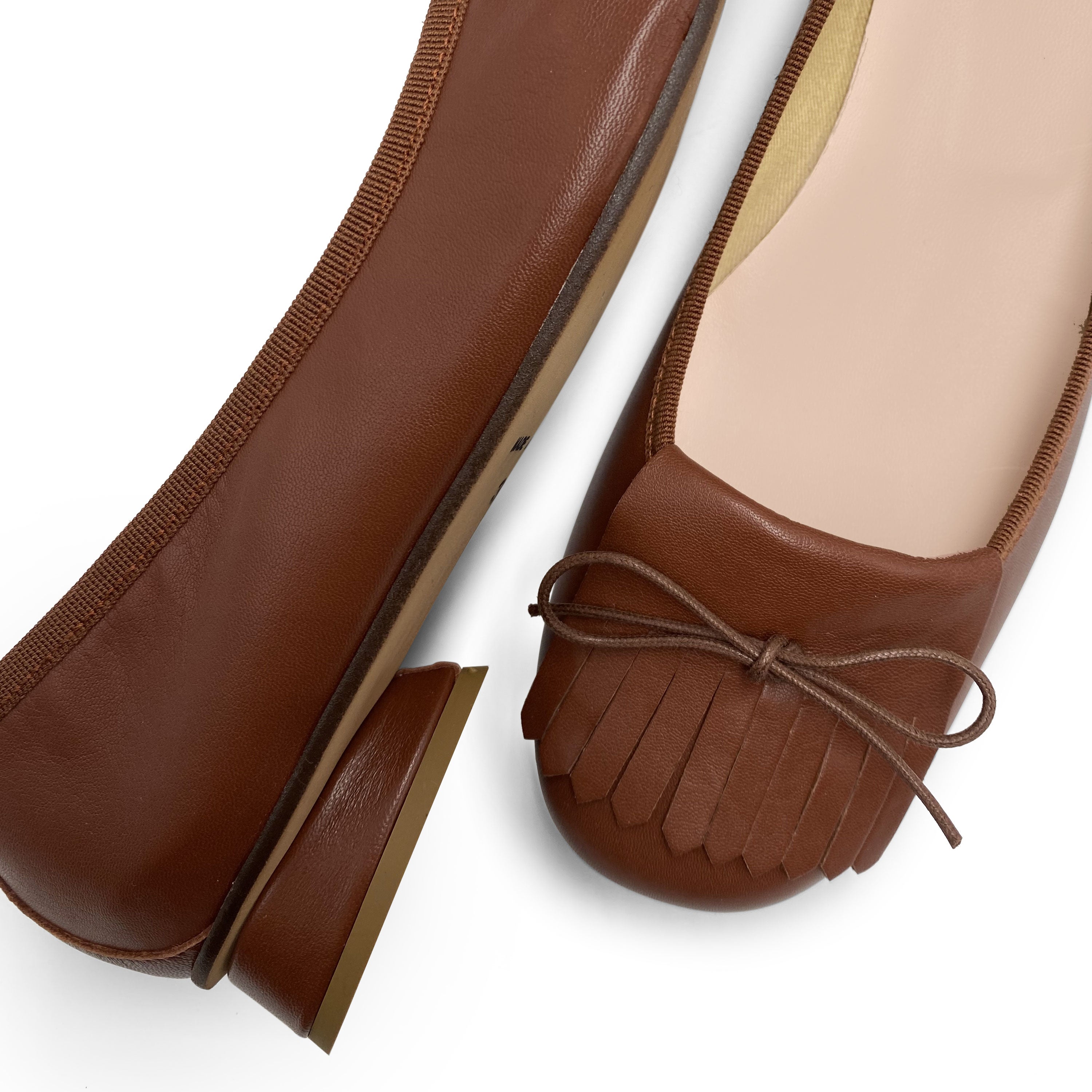 Mocassini marroni in pelle con tacco e frangia