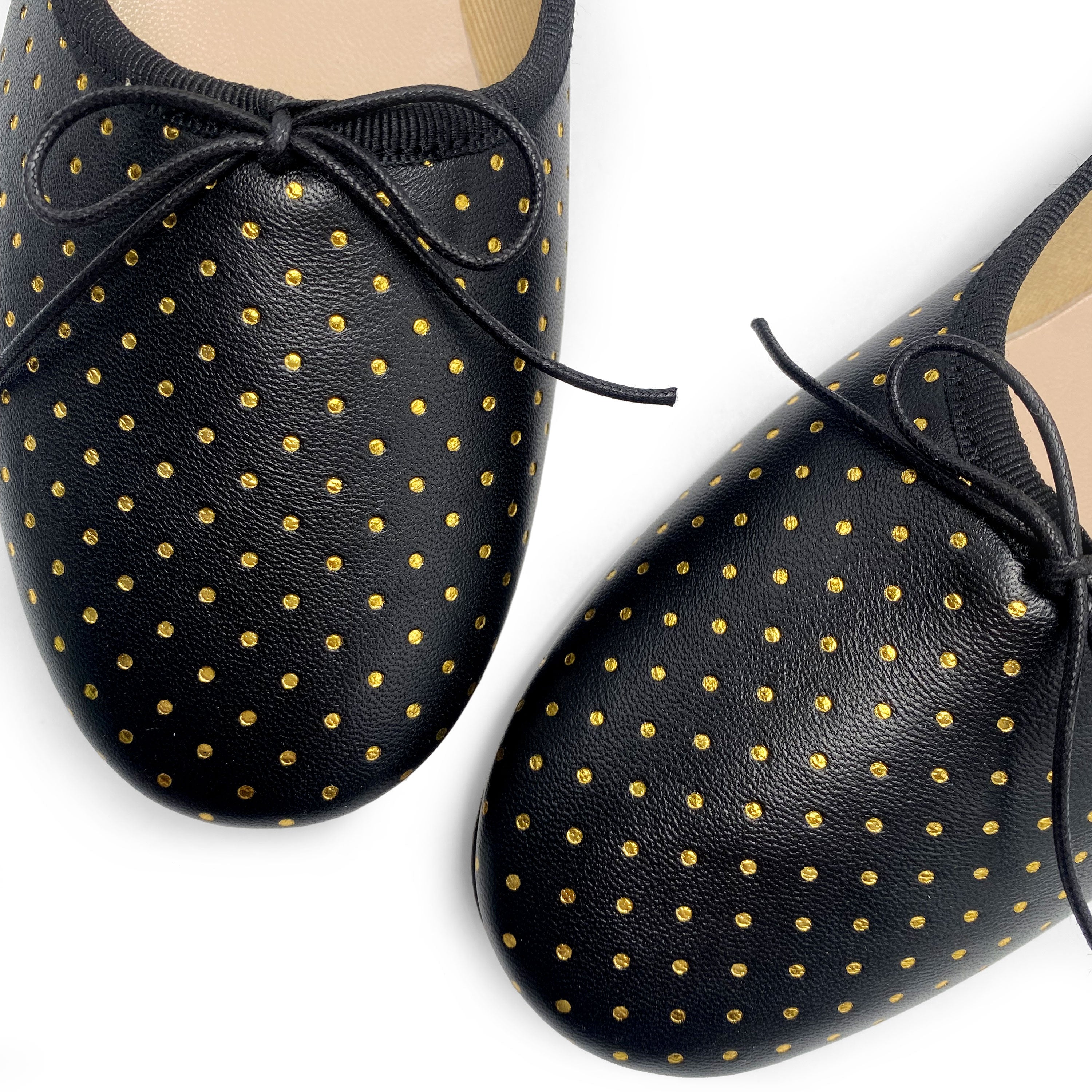 Black leather ballet flats with gold micro polka dots