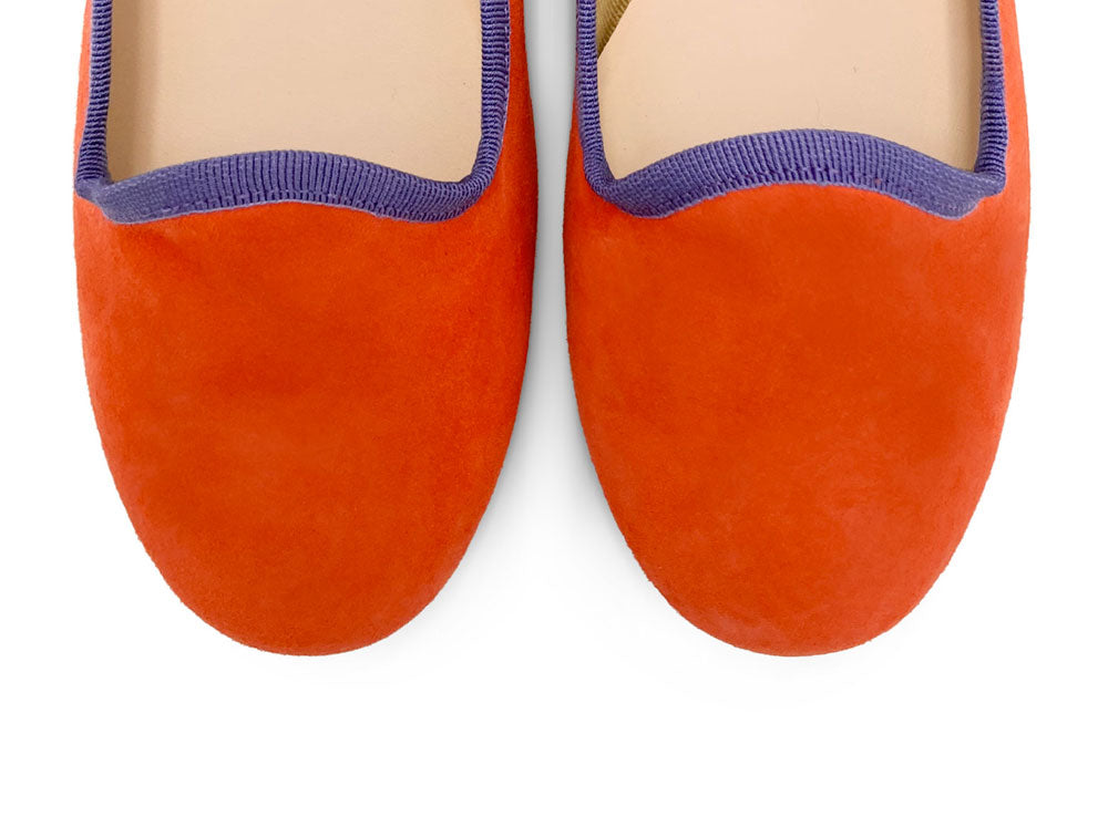 Women's orange suede loafers with purple details