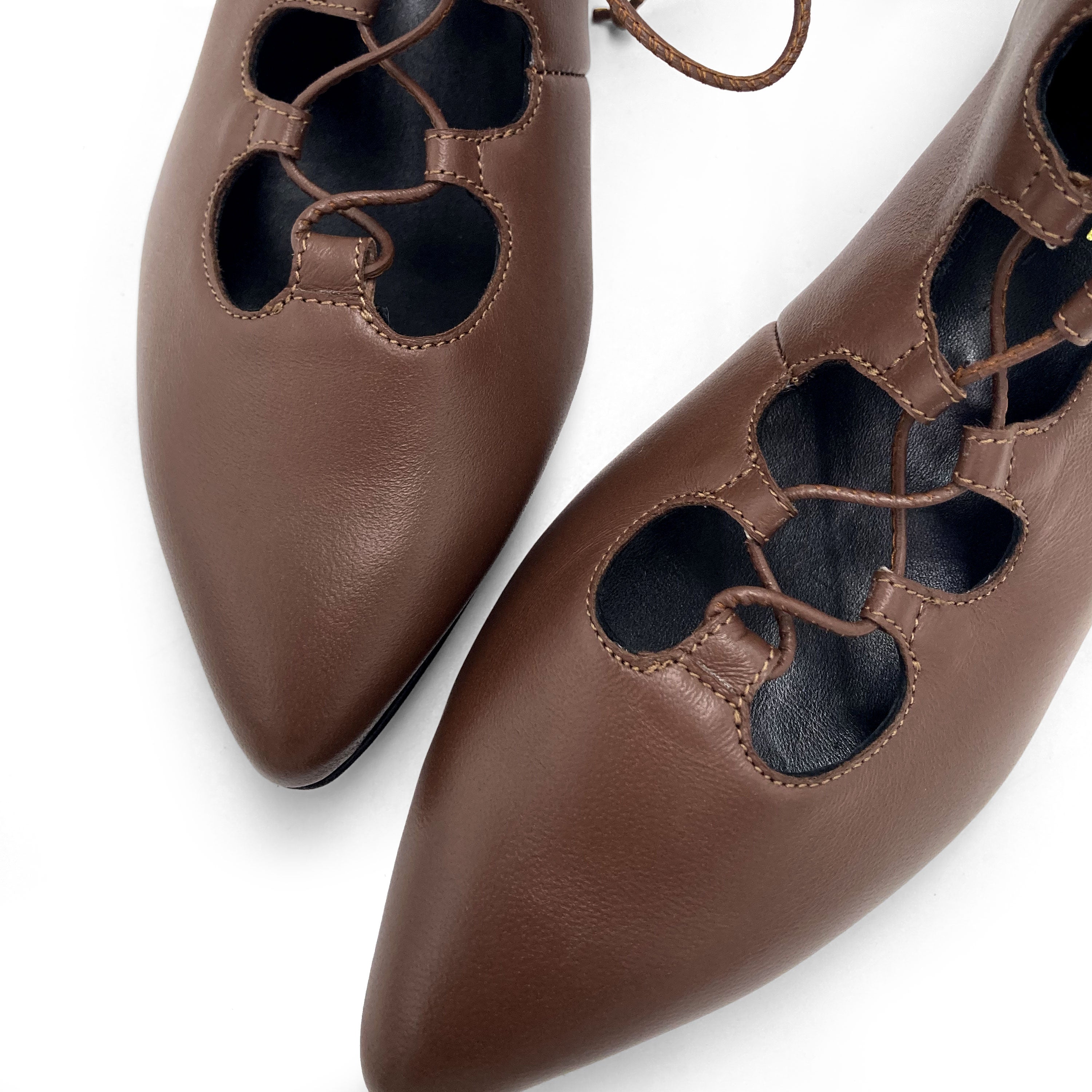 Brown pointed ankle boots with laces