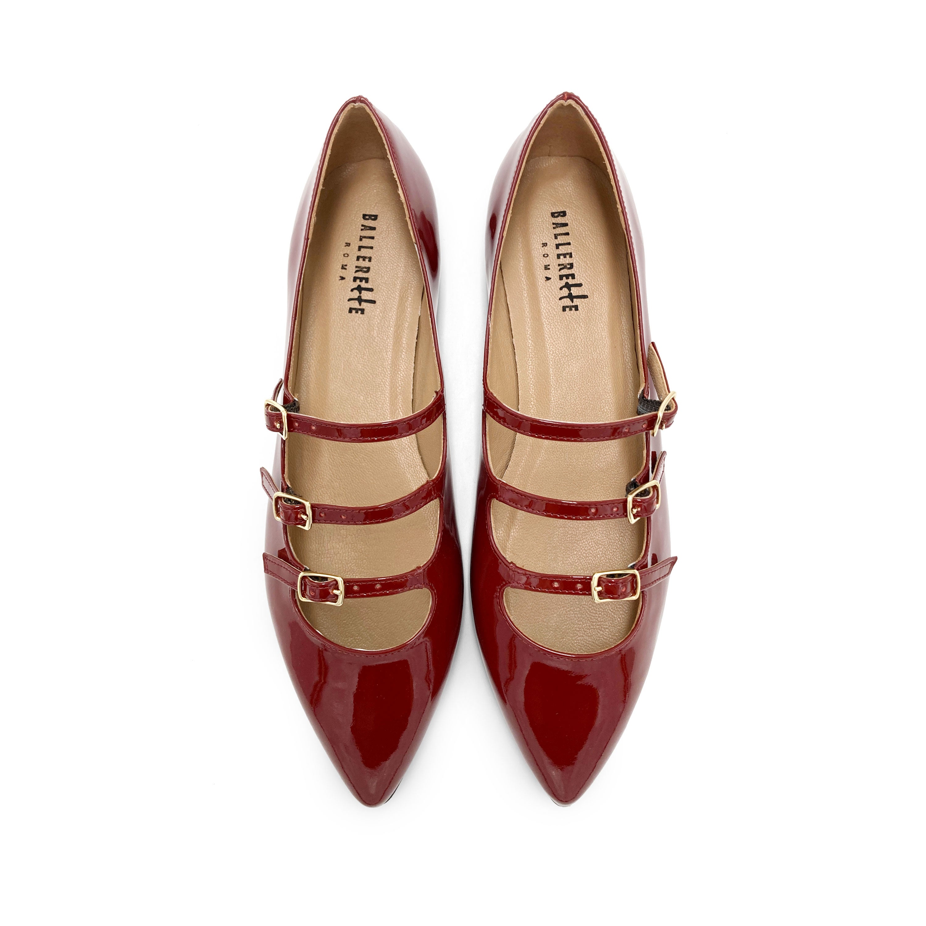 Red shiny pointed ballet flats with three straps