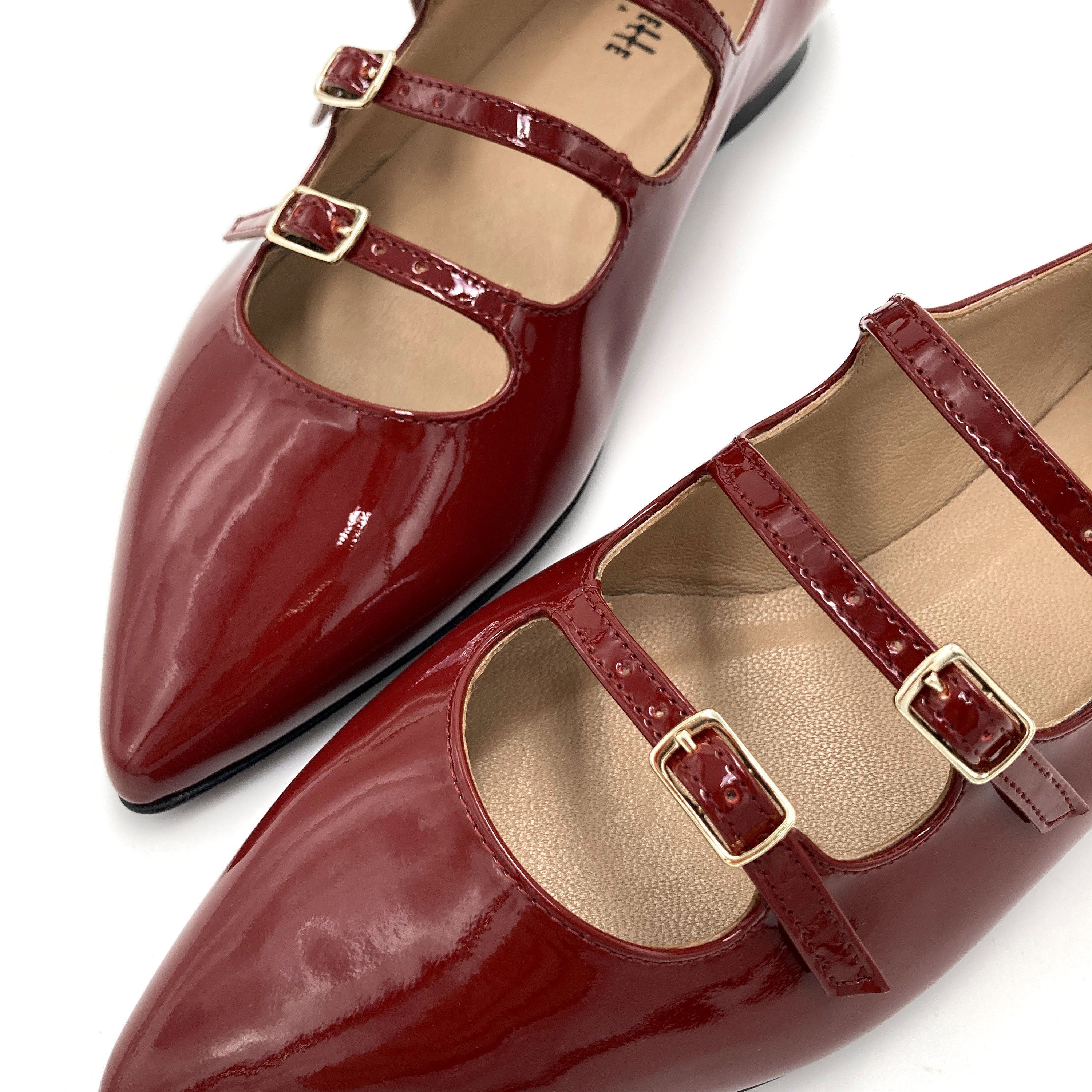 Red shiny pointed ballet flats with three straps