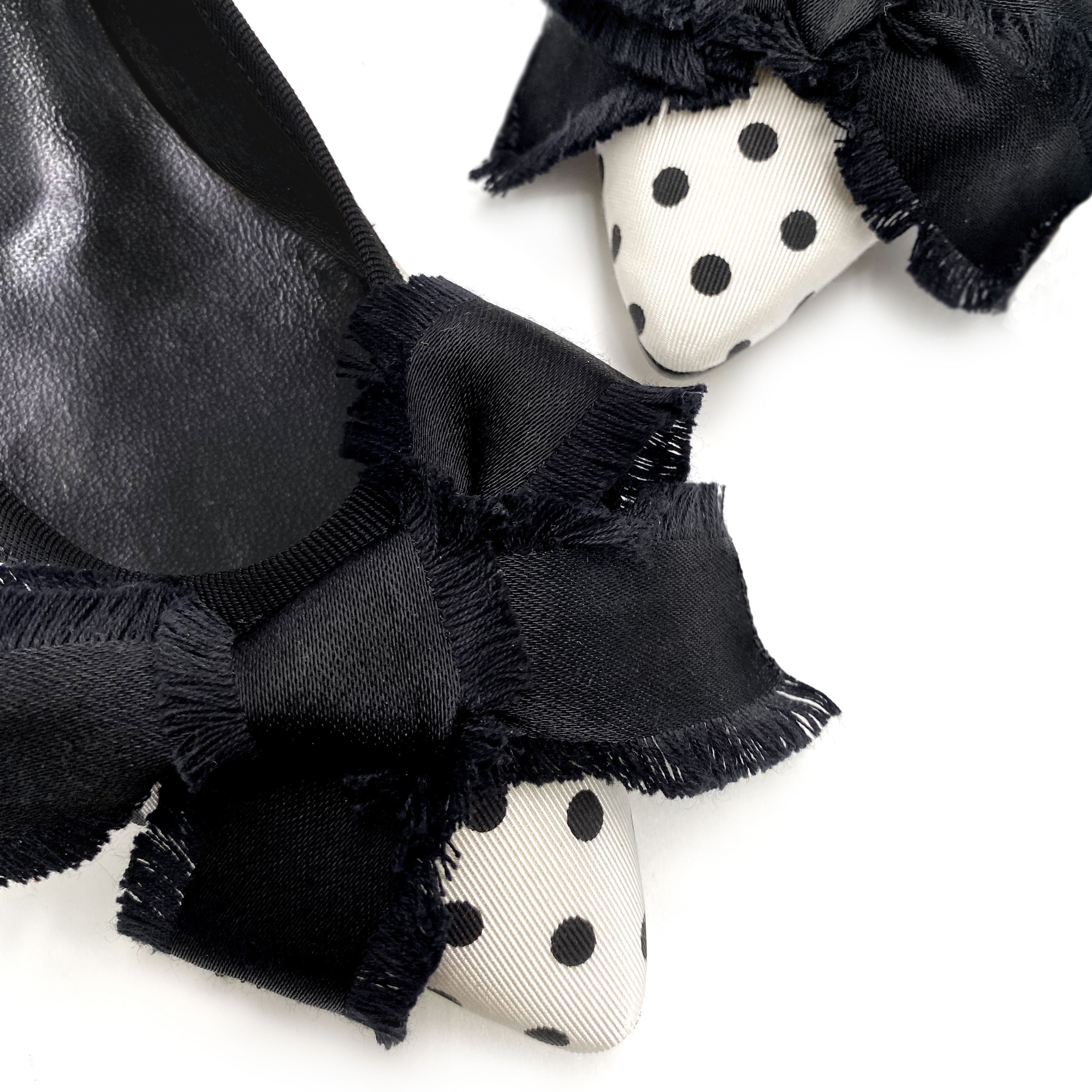 Black and white polka dot fabric ballet flats with bow