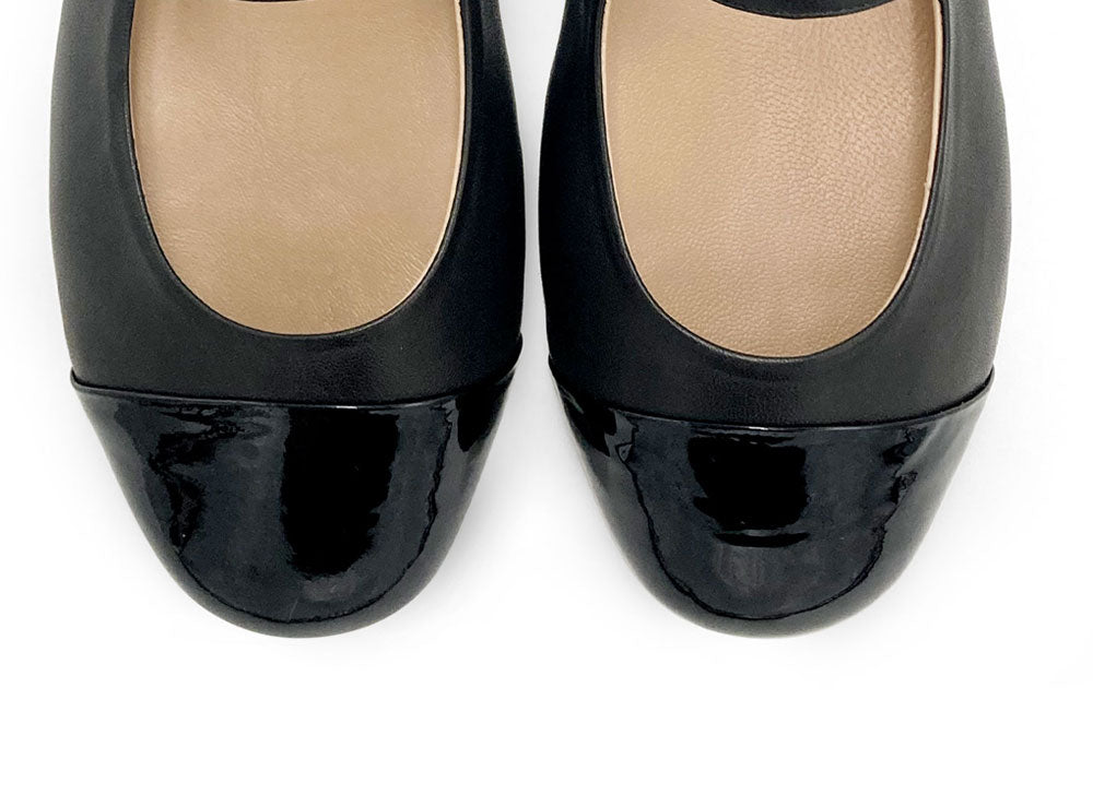 Black leather ballet flats with patent leather strap and toe