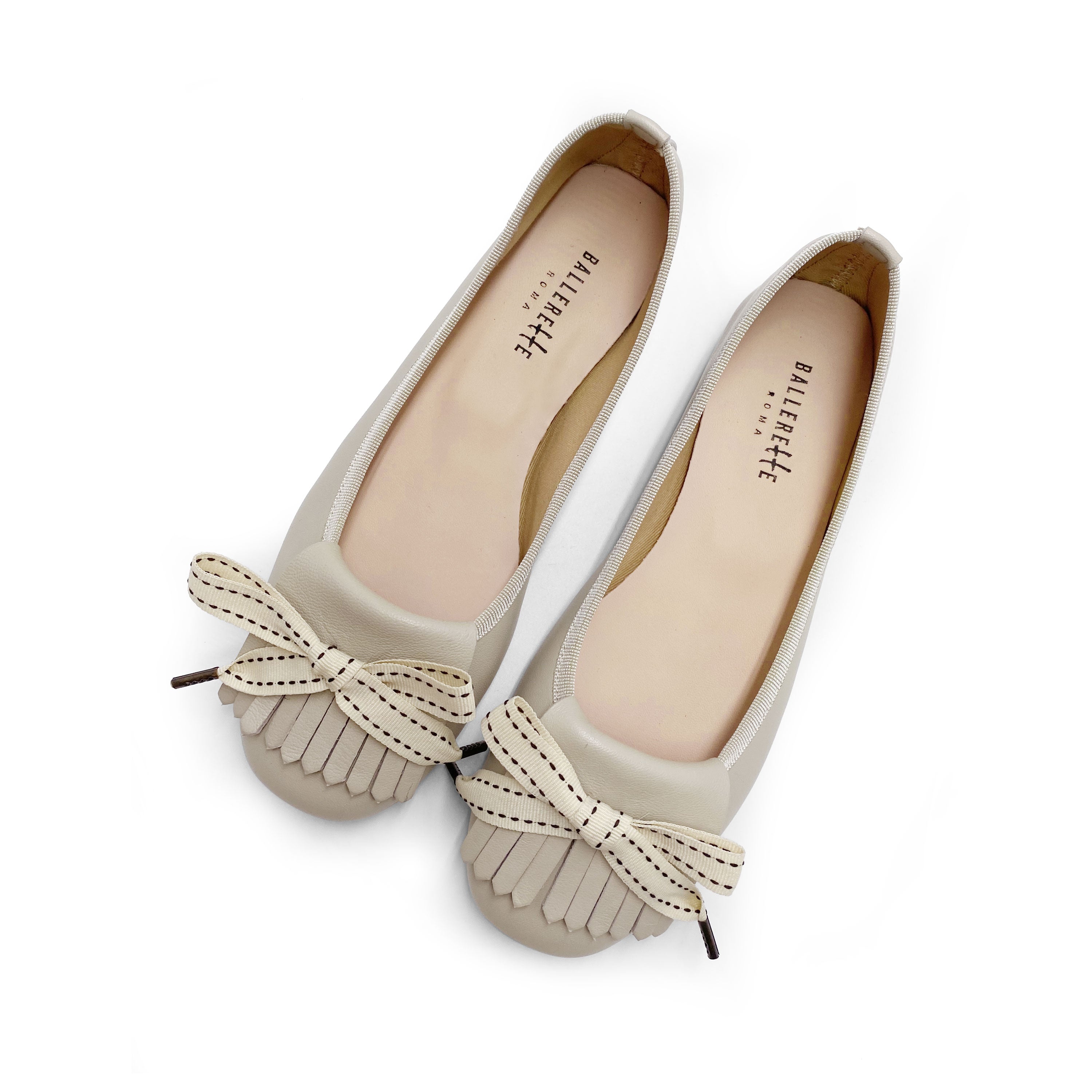 Mocassins en cuir beige à talon et frange