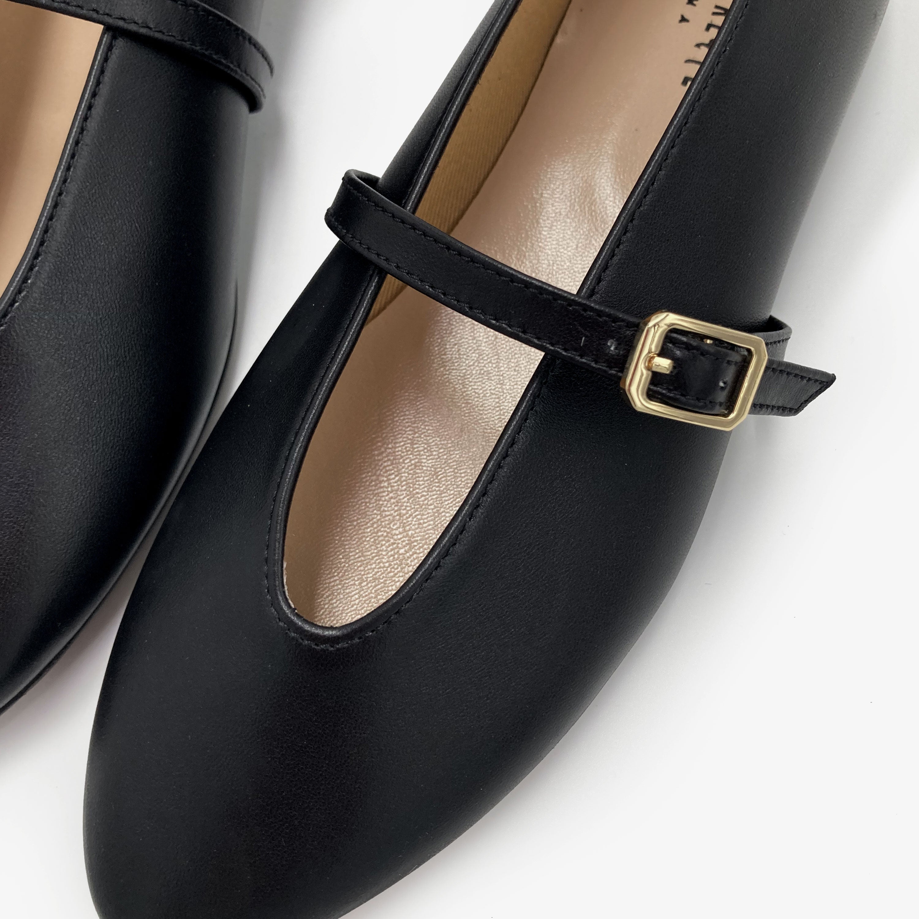 Black leather ballet flats with V-cut and strap