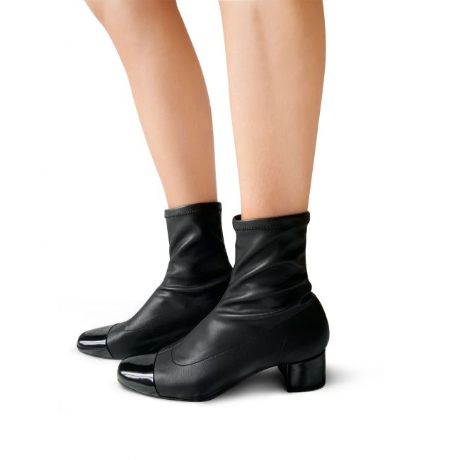 Black sock ankle boots with black patent leather toe