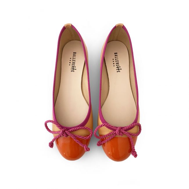 Peach pink leather ballet flats with orange toe and fuchsia bow