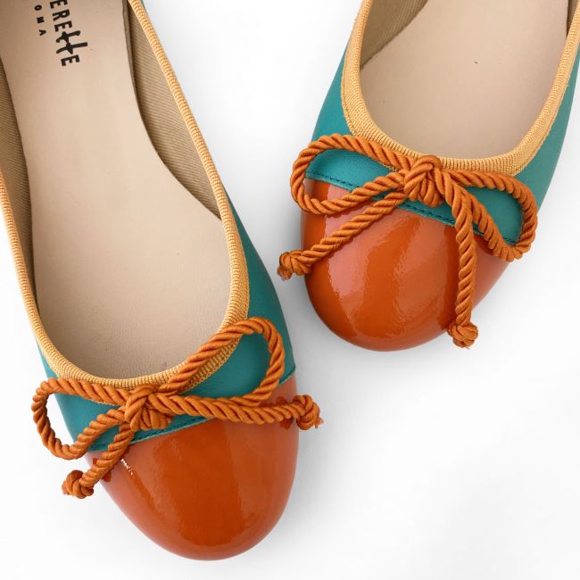 Teal leather ballet flats with orange toe and bow