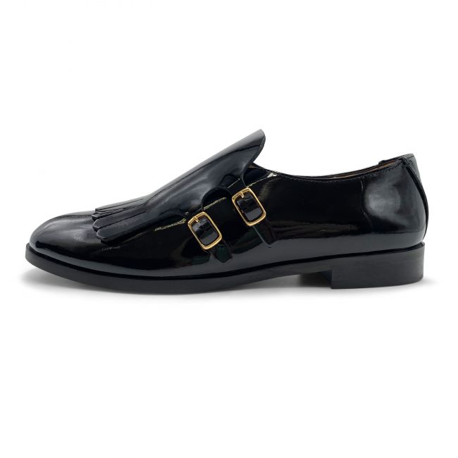 Women’s black patent leather oxford with buckles and fringe