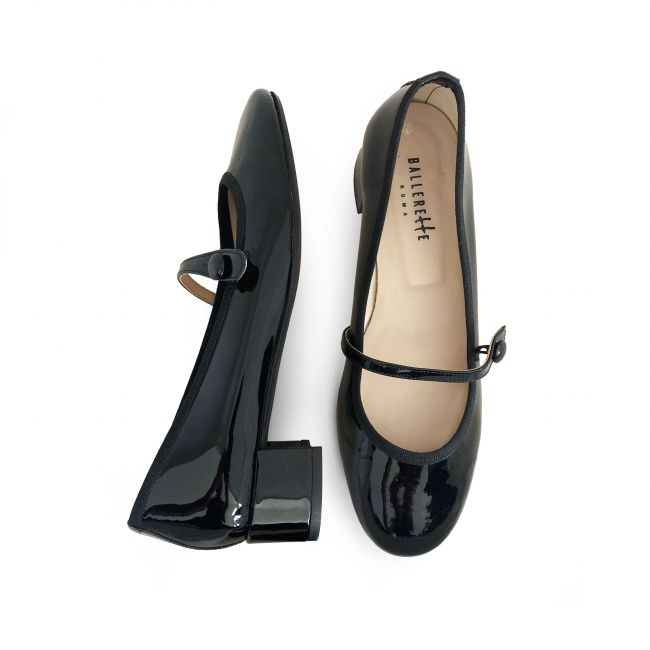 Black patent leather ballet flats with strap and heel