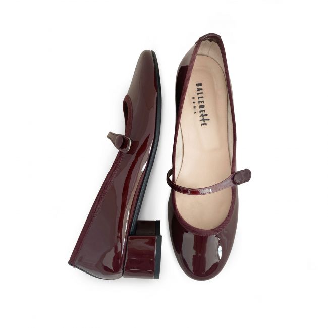 Burgundy patent leather ballet flats with strap and heel