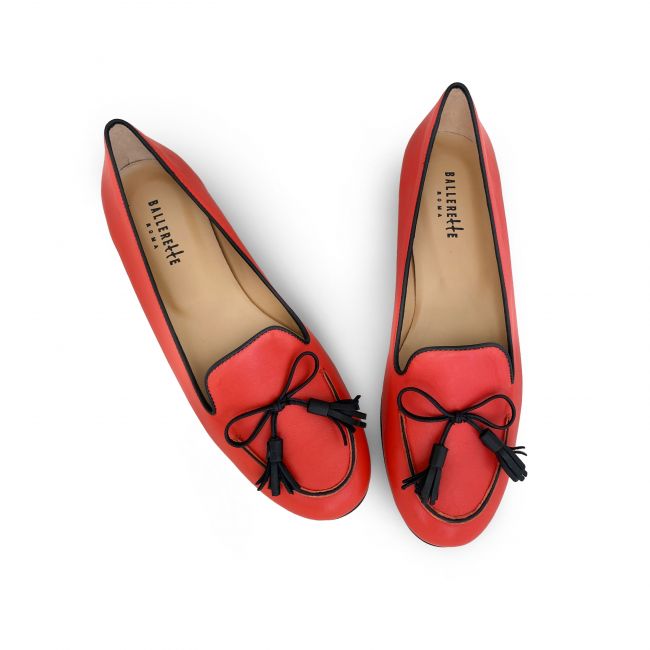 Coral red leather moccasins with black bow