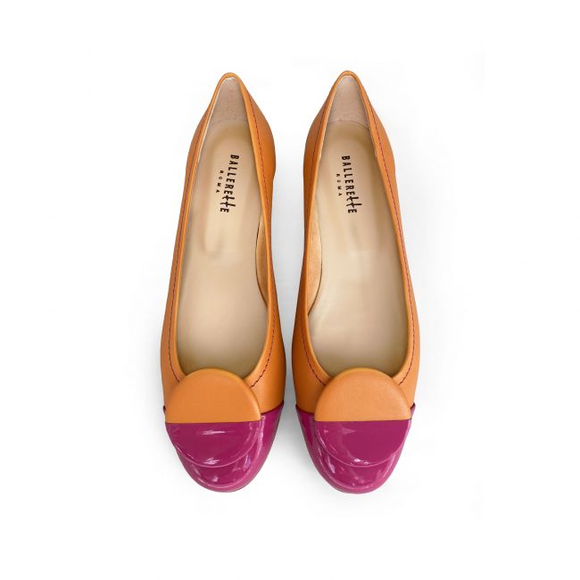 Orange leather ballet flats with fuchsia patent leather toe and stud