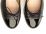 Black leather ballet flats with high heel and patent toe
